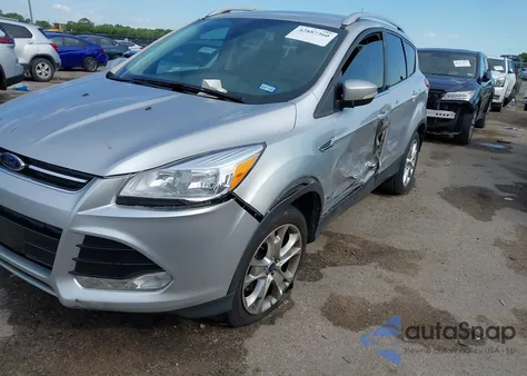2016 Ford Escape Titanium z USA, uszkodzony, nr VIN 1FMCU0J91GUB70915